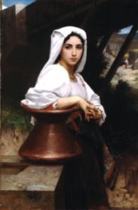A beautiful young woman waiting patiently by a well