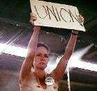 Norma Rae urges her fellow workers to stand up for better working conditions