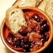 Olives, bread, plate of stew