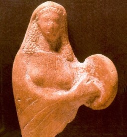 Ancient statue of a woman playing a tambourine