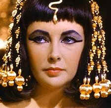 Cleopatra dressed in the royal regalia of a queen; from the movie 'Cleopatra' starring Elizabeth Taylor.