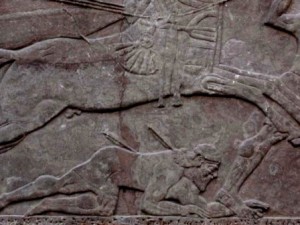 Battle scene from the northwest palace at Nimrud, showing warrior pierced by arrows, and chariot horses