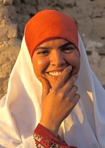 Middle Eastern woman in orange head scarf
