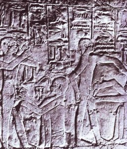 Egyptian wall relief showing priests using knives to circumcise two young men