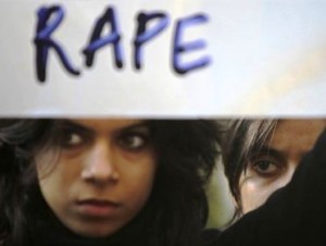 Two women with Rape protest sign