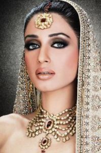 A Middle Eastern woman loaded down with jewelry