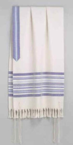 A beautiful hand-woven tallit, or Jewish prayer shawl with fringe