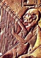 Ancient Egyptian wall carving of a harpist