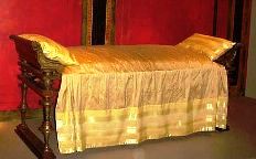 Divan with golden upholstery