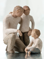 Wood carving of a father and his two sons