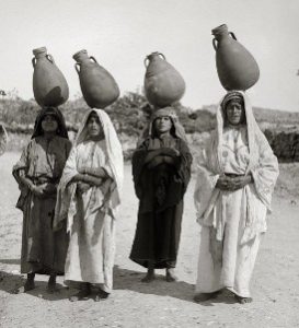 19th century photograph of Palestinian women carrying water jars