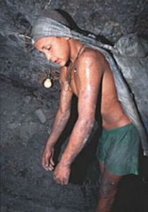 Young boy working in an underground mine