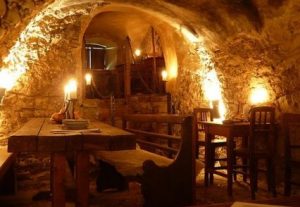 Interior of a tavern cut into the rock wall