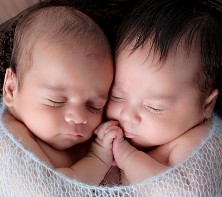 Newborn twins, one with more hair than the other - like Esau and Jacob. Photograph by Kyla Baker at kylabakerphotography.com