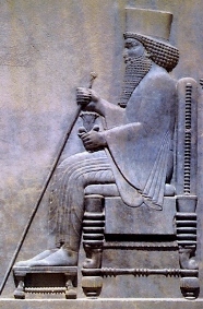 Stone carving of King Darius on his throne; notice the turned legs of the throne, which would have been carved with a lathe