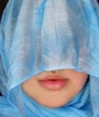 Woman with heavy veiling over her face