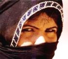 Middle Eastern woman with veil shielding her face