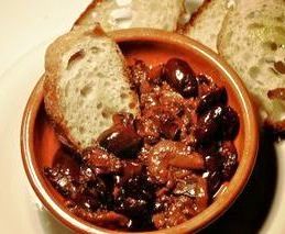 A simple, tasty bowl of olives, baked onions and bread