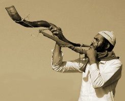 Man blowing the Shofar, photograph by Roie Galitz; this was the horn described in the story of Joshua and the fall of Jericho