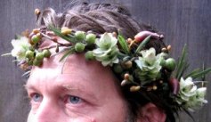 Man with a garland of flowers in his hair