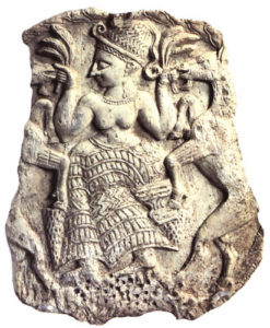 Ancient carving of a fertility goddess with goats