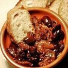 Bowl of stew, olives, bread
