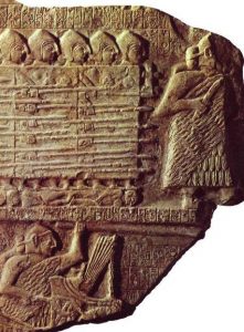 Eannatum, King of Lagash, leads charging troops; he holds a long spear in his left hand and 