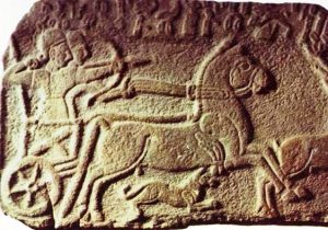 Assyrian chariot with archer, stone wall relief